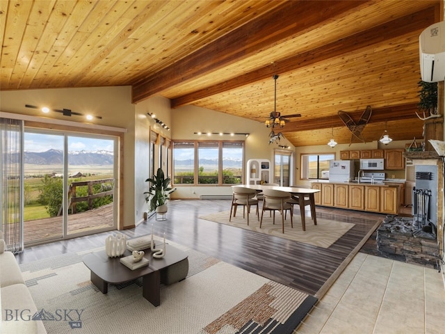 interior space with a wall mounted AC, ceiling fan, wooden ceiling, beamed ceiling, and a mountain view