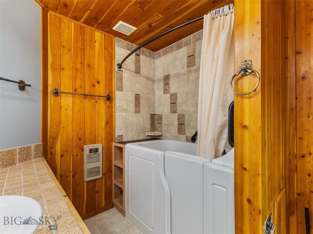 bathroom featuring heating unit, wood walls, wooden ceiling, and shower / tub combo