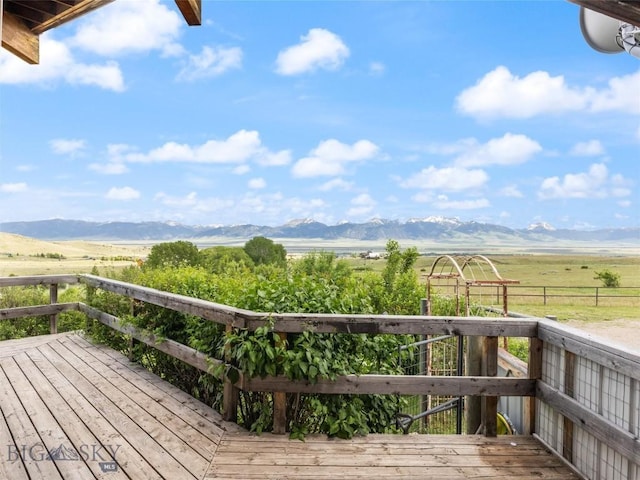 deck with a mountain view and a rural view