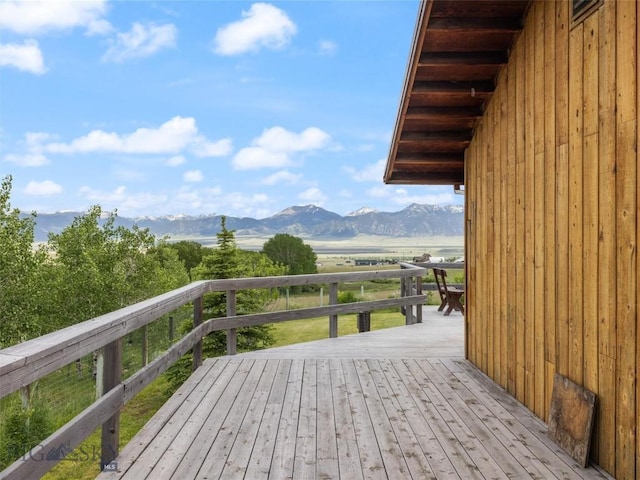 wooden terrace with a mountain view and a rural view