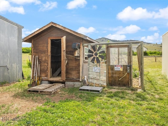 view of outdoor structure with a lawn