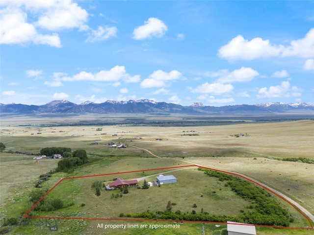 aerial view with a mountain view and a rural view