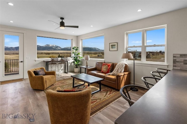 420 Sage Ave Unit D, Ennis, MT 59729 - living area featuring plenty of natural light, wood finished floors, ceiling fan, recessed lighting, and a mountain view