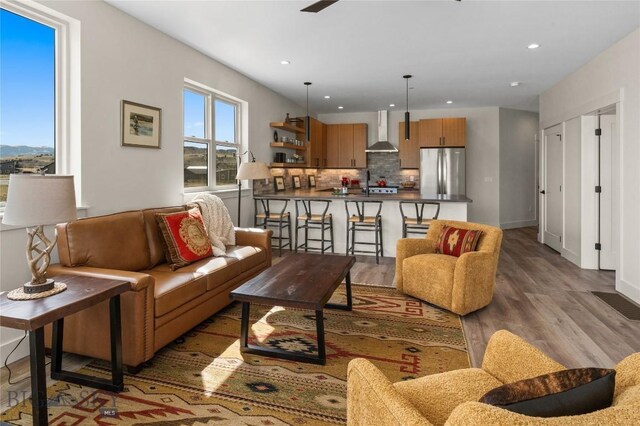 420 Sage Ave Unit B, Ennis, MT 59729 - living area featuring a ceiling fan, wood finished floors, and recessed lighting