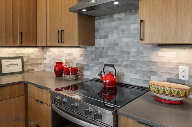420 Sage Ave Unit B, Ennis, MT 59729 - kitchen with electric range, under cabinet range hood, and tasteful backsplash