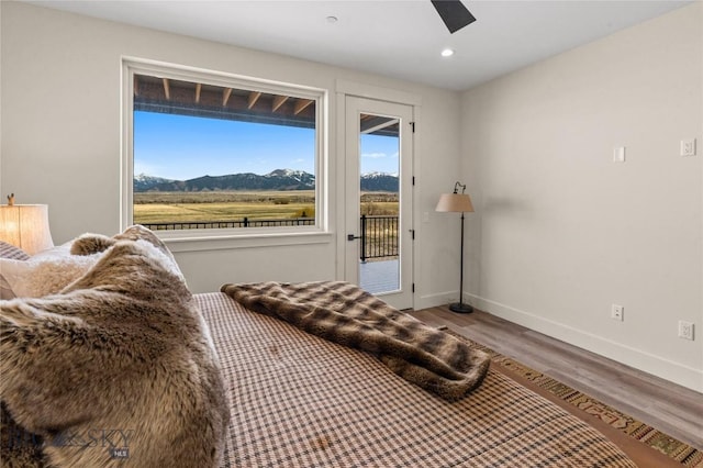 420 Sage Ave Unit B, Ennis, MT 59729 - bedroom featuring a mountain view, access to exterior, baseboards, recessed lighting, and wood finished floors