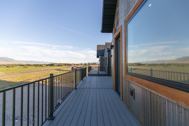 deck featuring a mountain view and a rural view