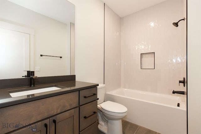 full bathroom with vanity, tiled shower / bath combo, and toilet