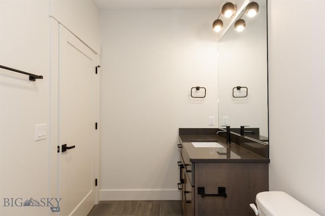 bathroom with vanity and toilet