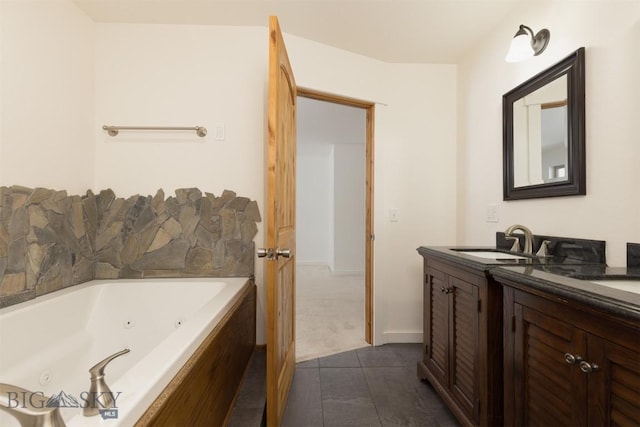 bathroom with a bathing tub, tile patterned flooring, and vanity