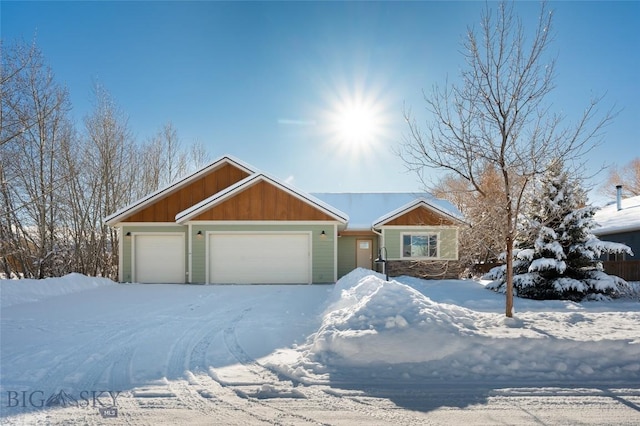 single story home featuring a garage