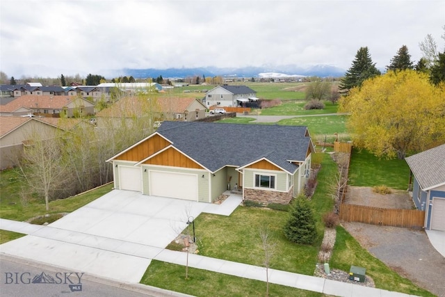 view of front of home with a front lawn and a garage