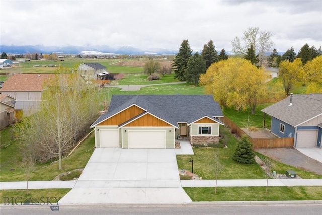 view of front of house with a garage and a front yard