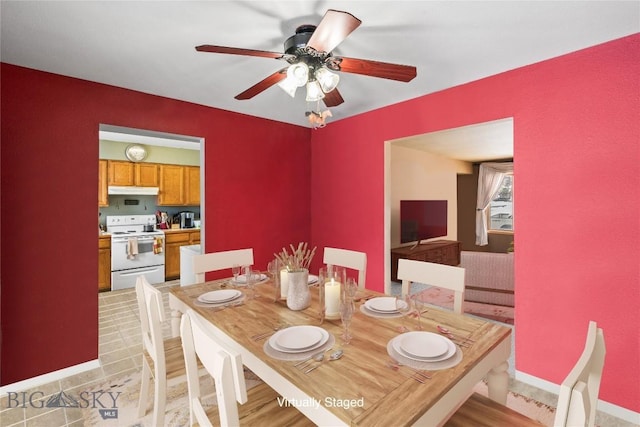 dining area with ceiling fan and light hardwood / wood-style floors