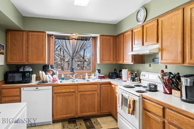 kitchen featuring white appliances and sink