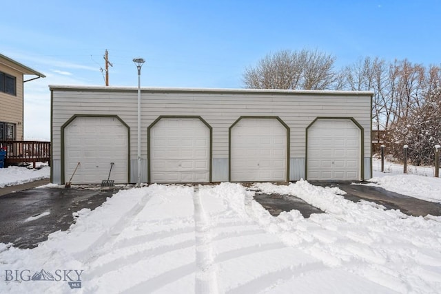 view of snow covered garage