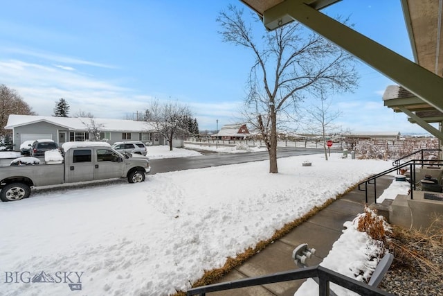 view of yard layered in snow