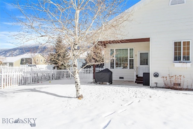 view of yard layered in snow