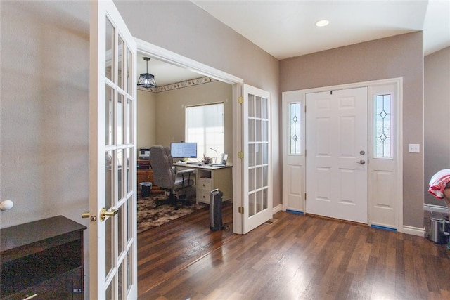 foyer with dark hardwood / wood-style flooring and french doors