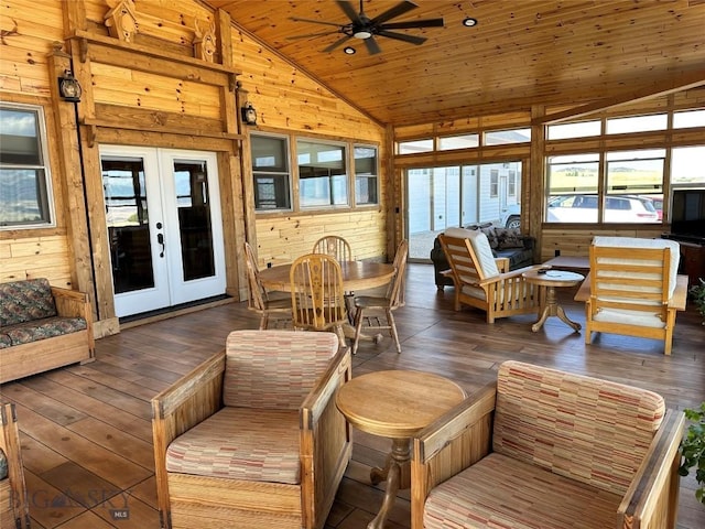 sunroom / solarium featuring lofted ceiling, french doors, wooden ceiling, and ceiling fan