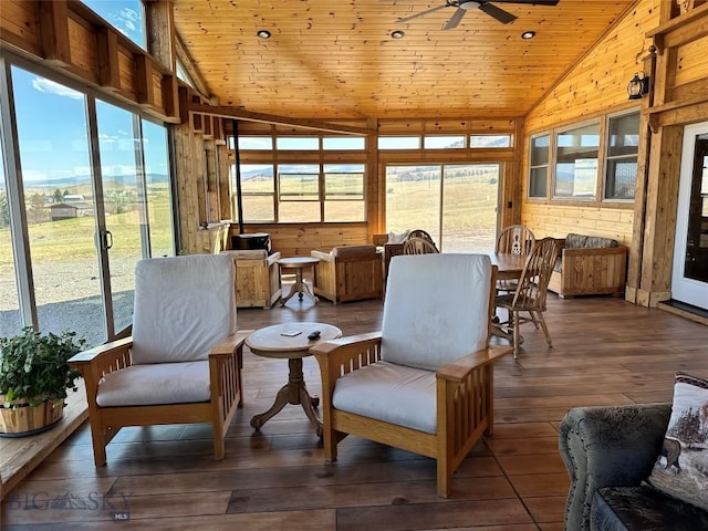 sunroom / solarium with ceiling fan, wooden ceiling, and lofted ceiling