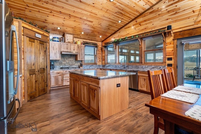 kitchen with appliances with stainless steel finishes, wooden ceiling, a center island, and hardwood / wood-style floors