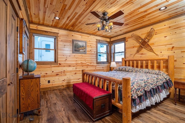 bedroom with hardwood / wood-style floors, wooden walls, ceiling fan, and wooden ceiling