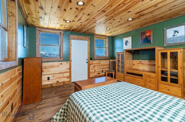 bedroom featuring wood-type flooring, wooden ceiling, and wood walls