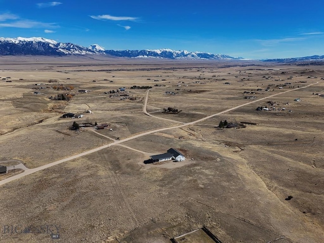 drone / aerial view featuring a mountain view