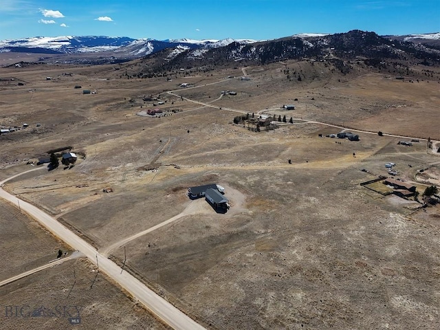 birds eye view of property with a rural view and a mountain view