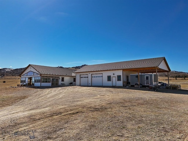 ranch-style house featuring a garage