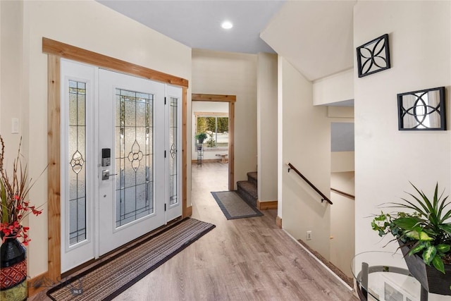 foyer entrance with light wood-type flooring