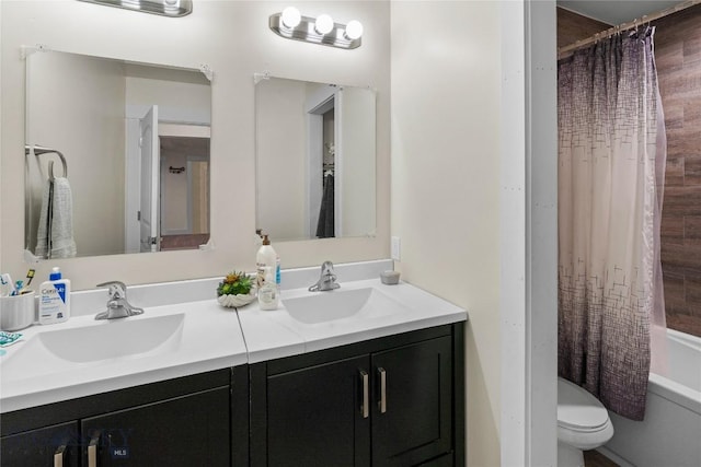 full bathroom featuring toilet, shower / tub combo, and vanity