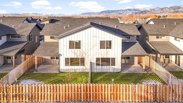 back of house featuring a patio and a mountain view