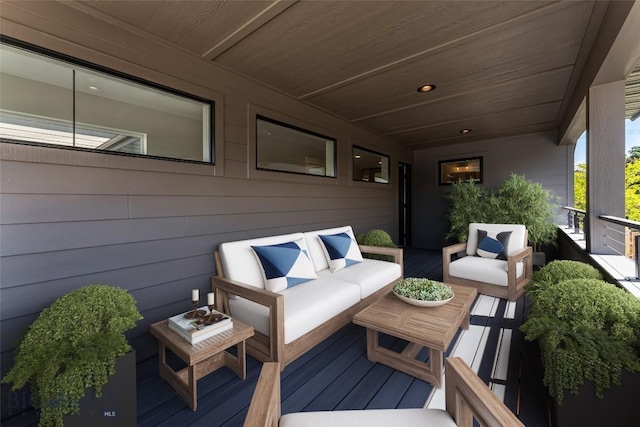 wooden deck featuring outdoor lounge area