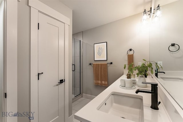 bathroom featuring vanity, tile patterned flooring, and a shower with shower door