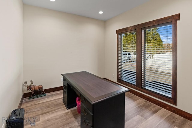 office space with light wood-type flooring