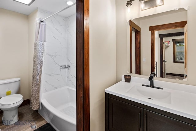 full bathroom featuring toilet, shower / bathtub combination with curtain, wood-type flooring, and vanity