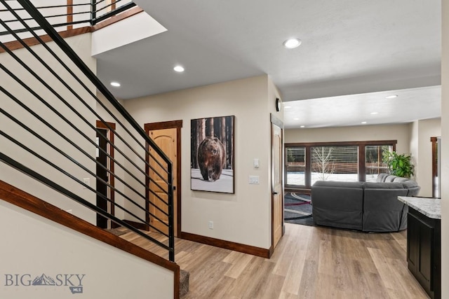 stairway featuring wood-type flooring