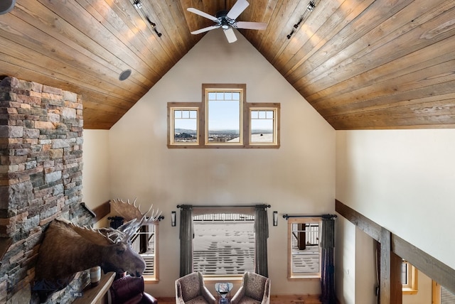 unfurnished living room with wooden ceiling, ceiling fan, and vaulted ceiling