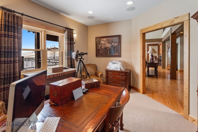 carpeted office with wood finished floors, recessed lighting, and baseboards