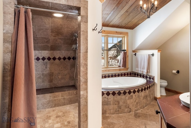 bathroom featuring toilet, a tile shower, baseboards, a bath, and vaulted ceiling