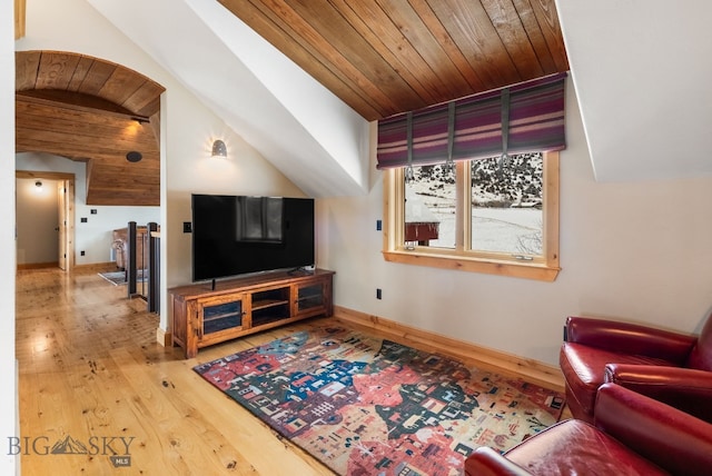 living room with hardwood / wood-style floors, wooden ceiling, baseboards, and lofted ceiling