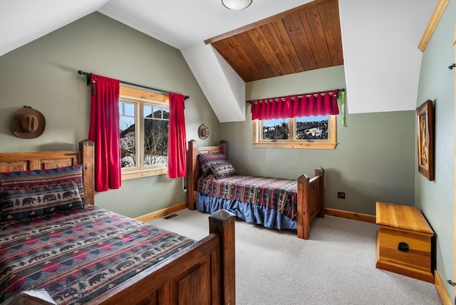 bedroom featuring visible vents, baseboards, carpet, and vaulted ceiling