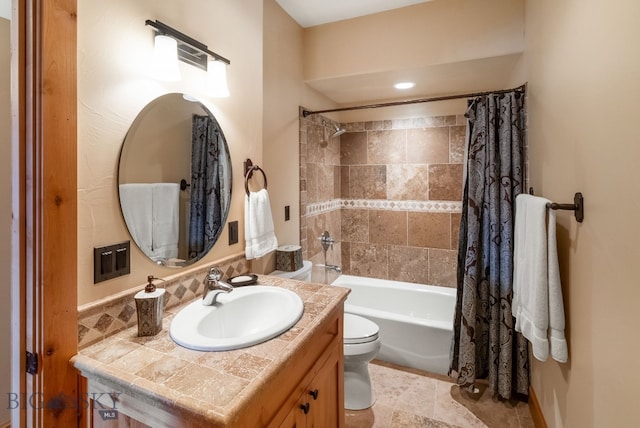 bathroom featuring vanity, tile patterned floors, toilet, and shower / bath combo with shower curtain