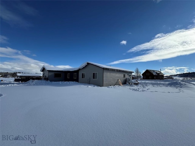 view of snow covered property