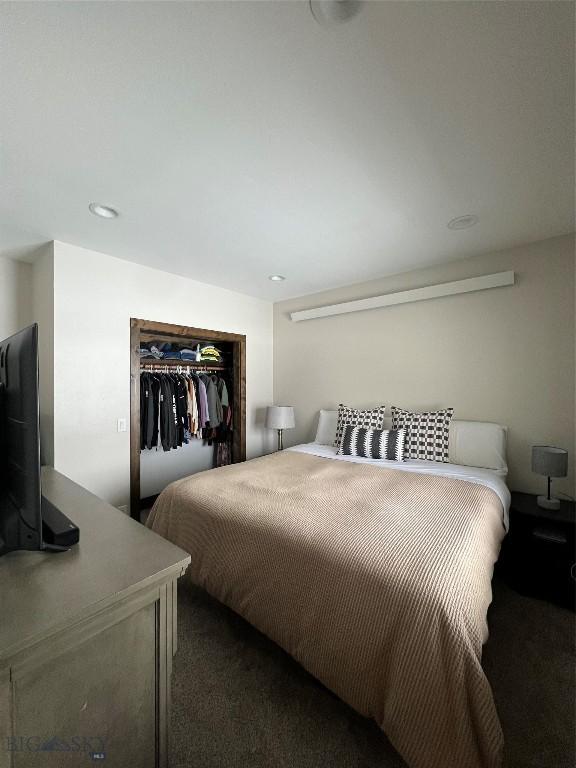 carpeted bedroom with a closet