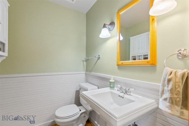 bathroom featuring sink and toilet