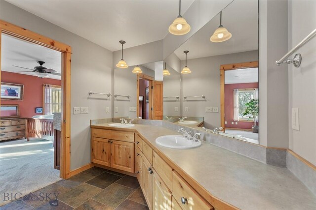 bathroom featuring ceiling fan and vanity