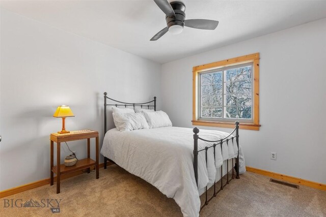 bedroom with ceiling fan and carpet floors